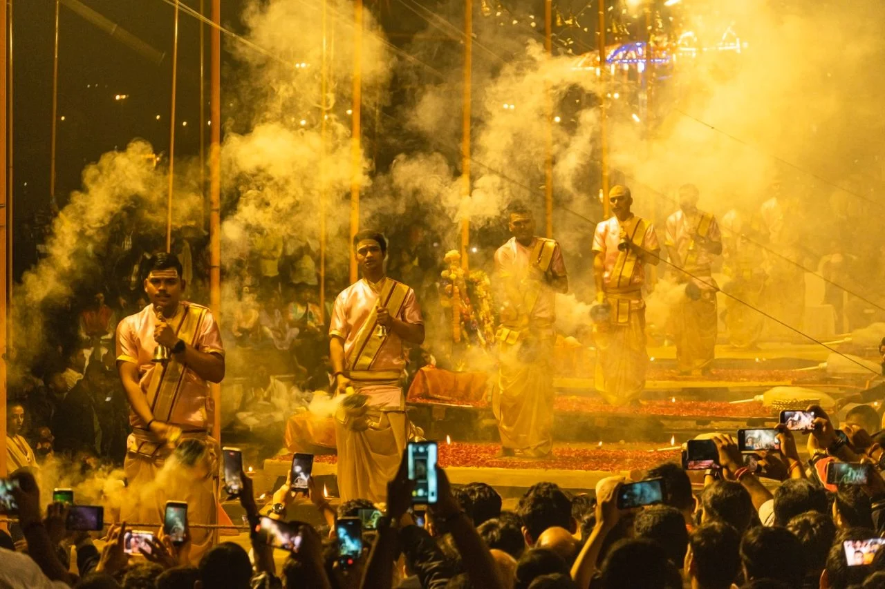 Priests performing the evening Ganga Aarti with lamps at Dashashwamedh Ghat in Varanasi