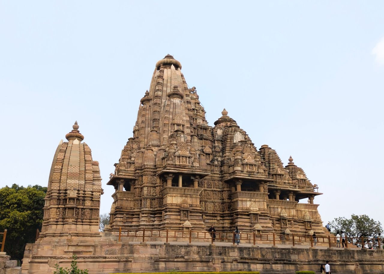 Kandariya Mahadeva Temple at Khajuraho with its tall carved shikhara rising above a raised platform